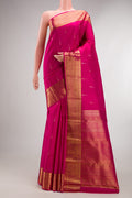 Pure Silk Rani Pink Kanchipuram Saree with Zari Butta on the body and Zari Border.  displayed on a mannequin
