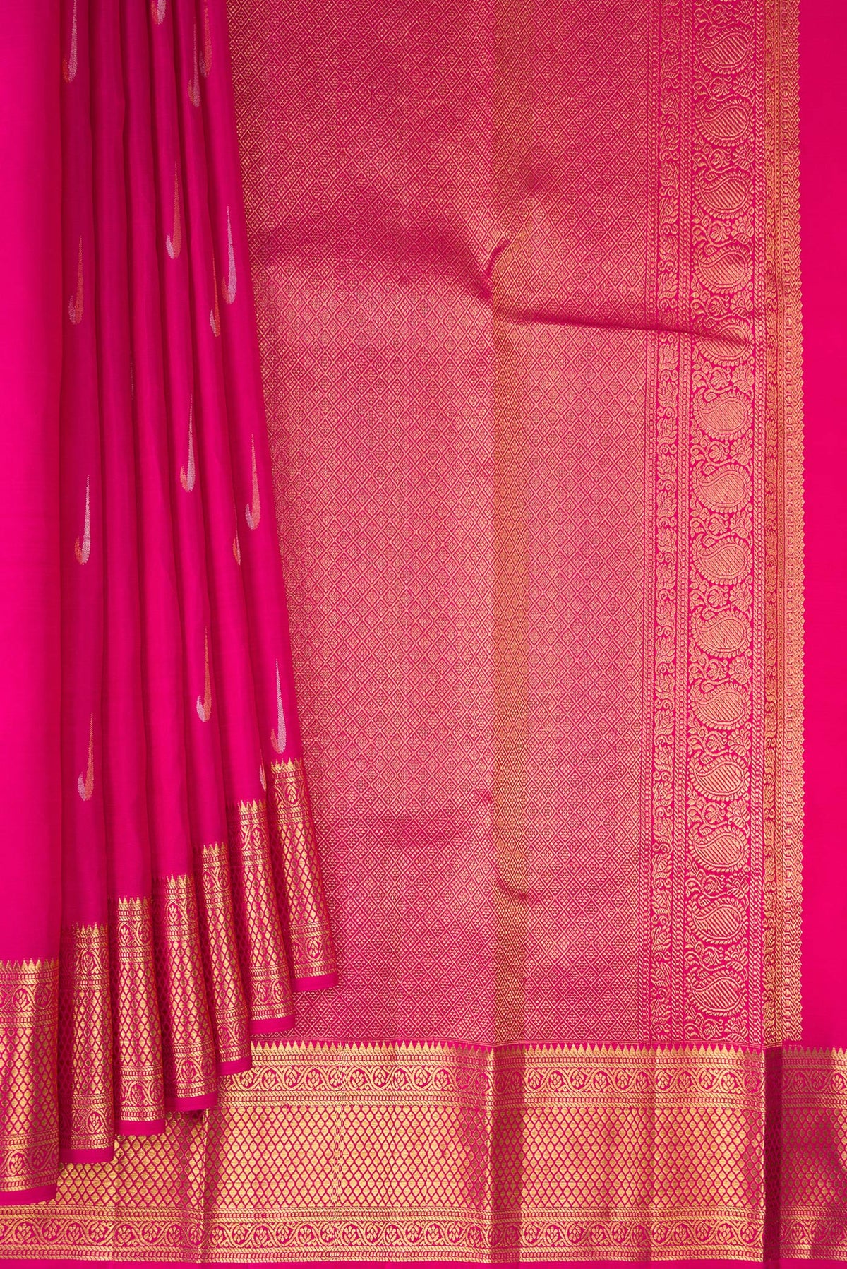 Pleats and pallu of Pure Silk Rani Pink Kanchipuram Saree with Zari Butta on the body and Zari Border. 