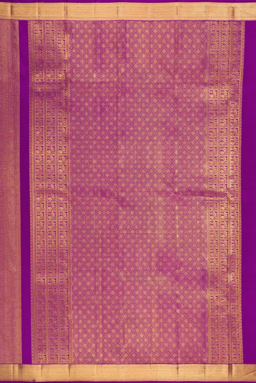 Close up image of the pallu of Purple Kanchipuram Silk Saree with Zari Brocade on the body and Zari Border. 