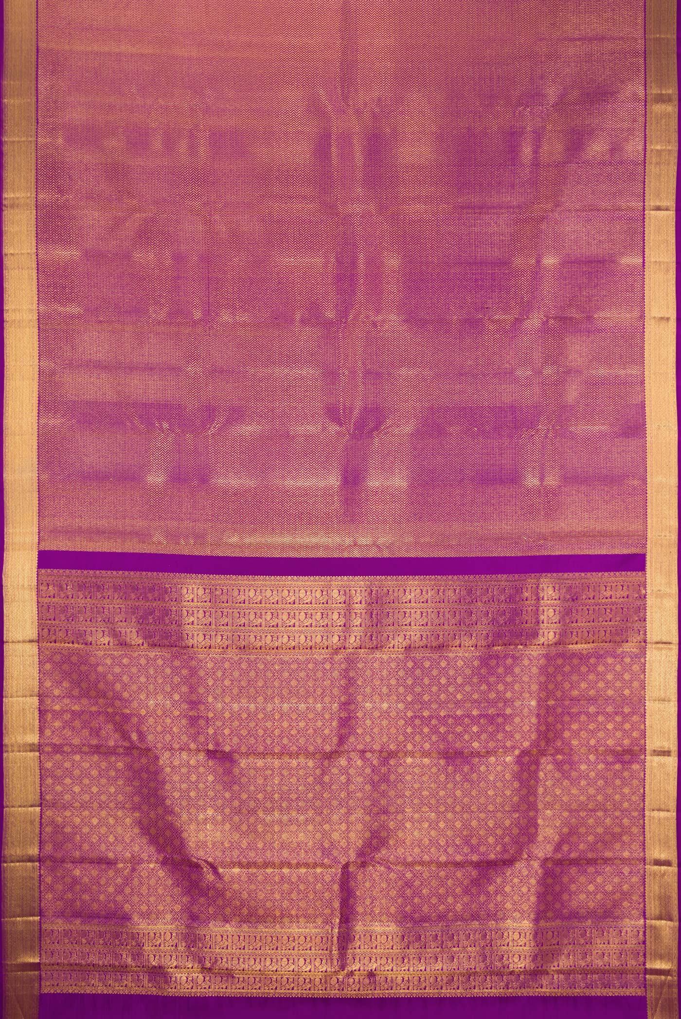 Flat view of Purple Kanchipuram Silk Saree with Zari Brocade on the body and Zari Border. 