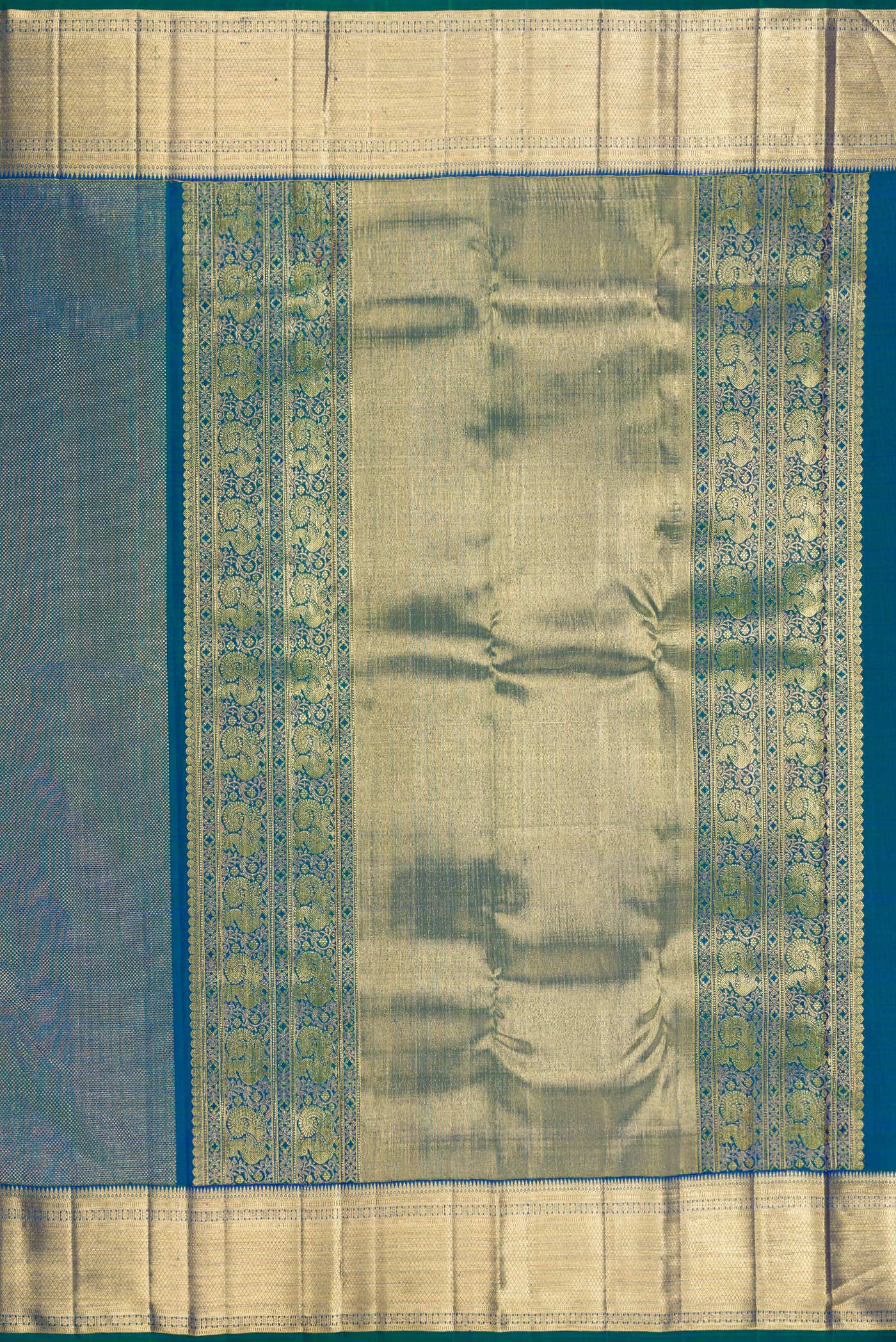 Close up image of the pallu of Peacock Blue Dual Tone Kanchipuram Silk Saree with Zari Brocade on the body and Zari Border. 