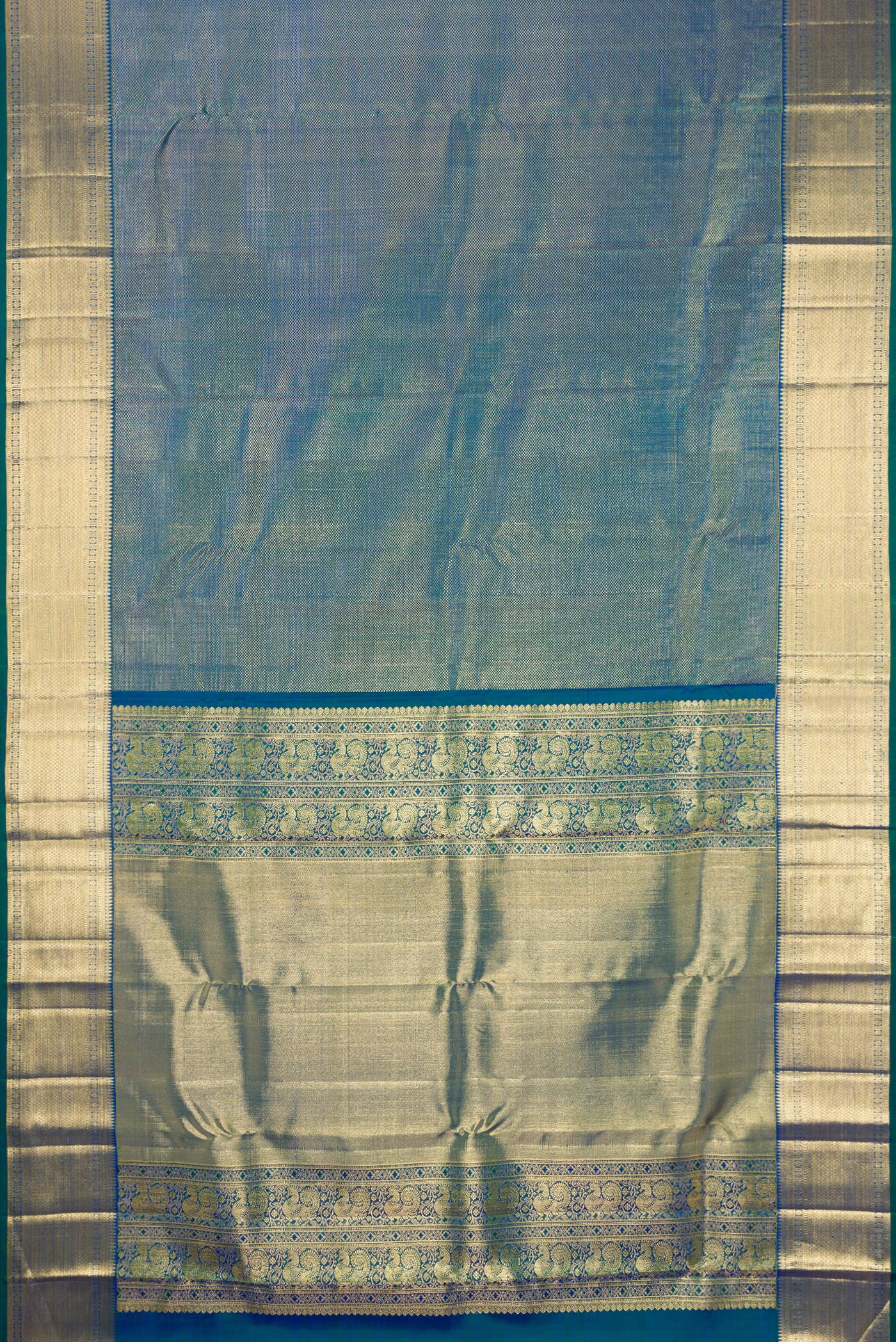 Flat view of Peacock Blue Dual Tone Kanchipuram Silk Saree with Zari Brocade on the body and Zari Border. 