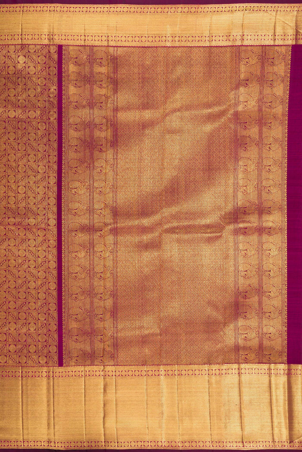 Close up image of the pallu of Magenta Dual Tone Kanchipuram Silk Saree with Zari Brocade on the body and Zari Border. 