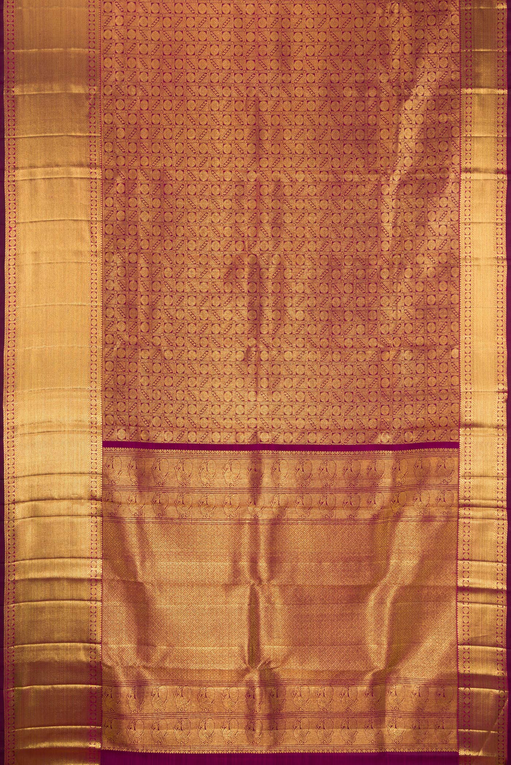 Flat view of Magenta Dual Tone Kanchipuram Silk Saree with Zari Brocade on the body and Zari Border. 