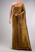 Coffee Brown Kanchipuram Silk Saree with Zari Brocade on the body and Fancy Border.  displayed on a mannequin