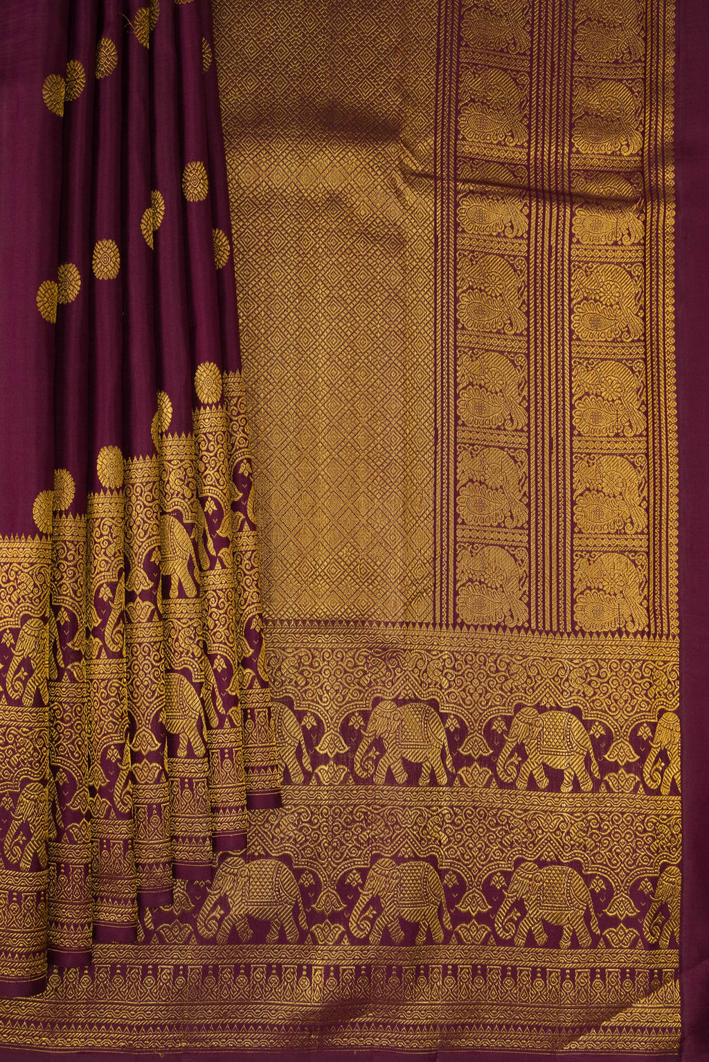 Pleats and pallu of Coffee Brown Kanchipuram Silk Saree with Zari Butta on the body and Fancy Border. 