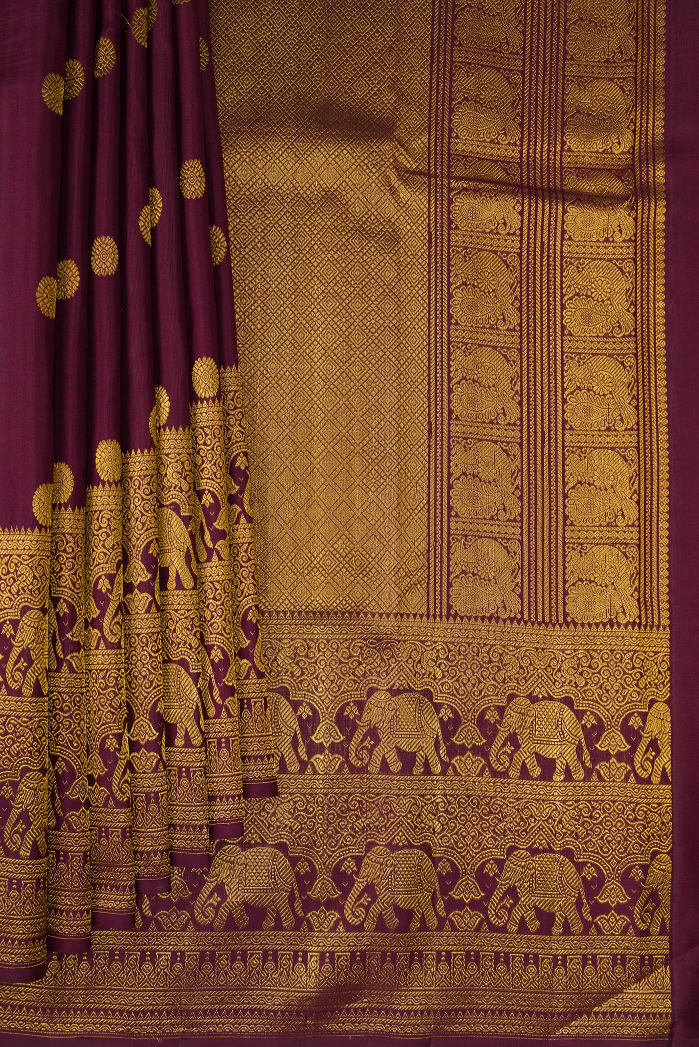 Pleats and pallu of Coffee Brown Kanchipuram Silk Saree with Zari Butta on the body and Fancy Border. 