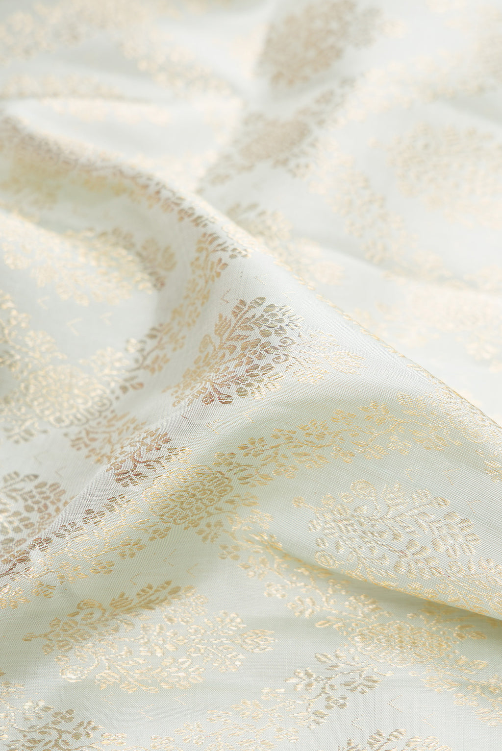 Close up of Light Blue Kanchipuram Silk Saree with Zari Brocade on the body and Fancy Border.  displaying folds