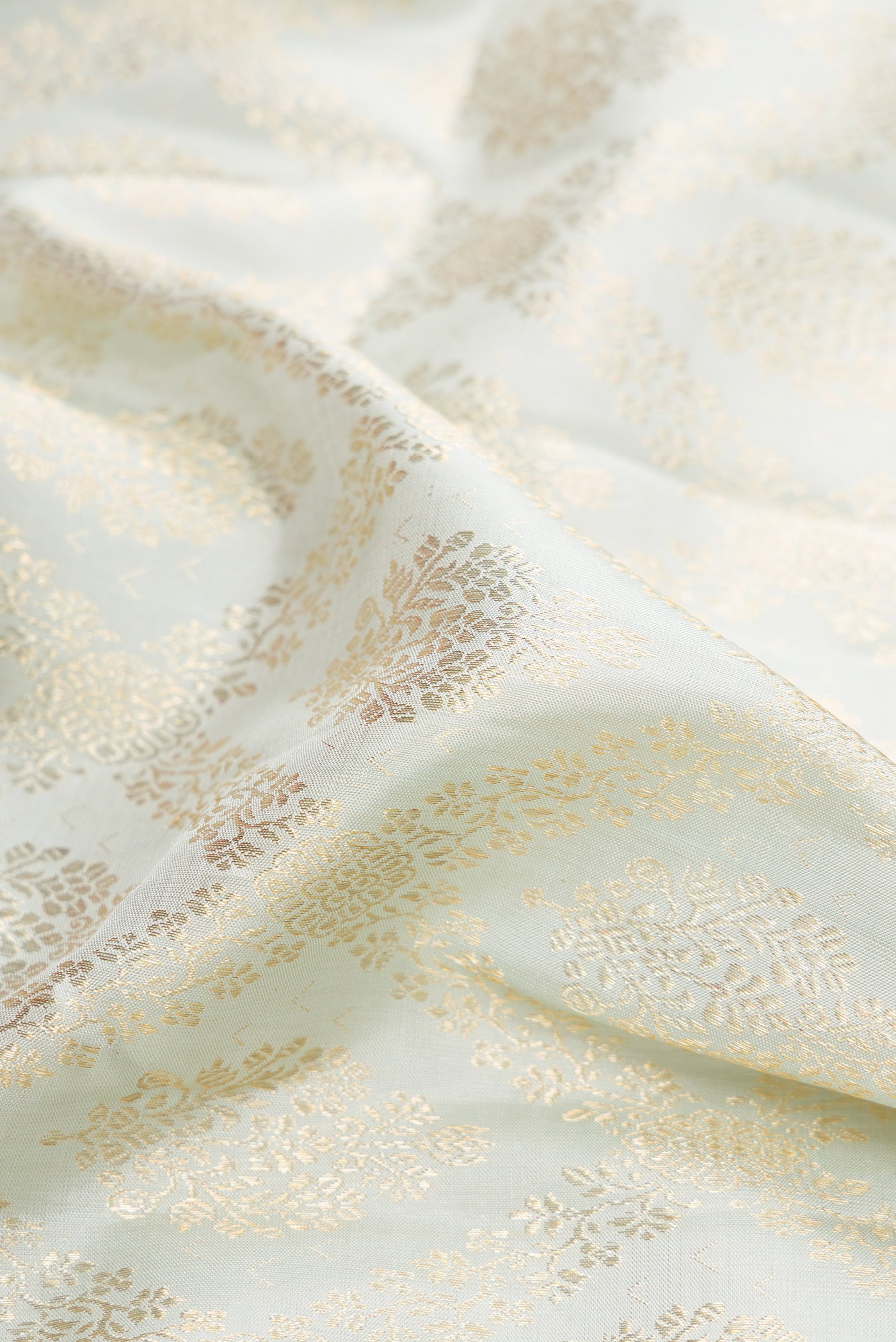 Close up of Light Blue Kanchipuram Silk Saree with Zari Brocade on the body and Fancy Border.  displaying folds
