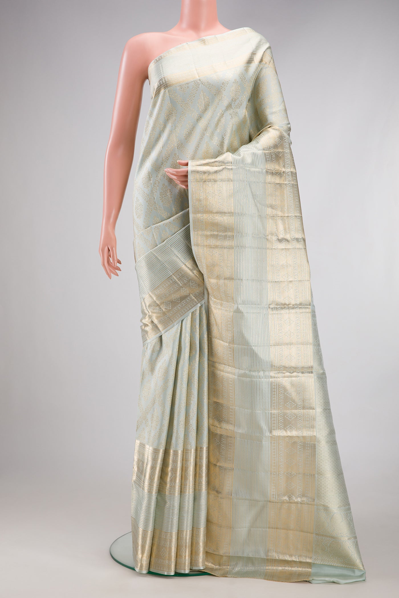 Light Blue Kanchipuram Silk Saree with Zari Brocade on the body and Fancy Border.  displayed on a mannequin