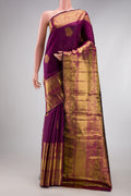 Magenta Dual Tone Kanchipuram Silk Saree with Zari Butta on the body and Fancy Border.  displayed on a mannequin
