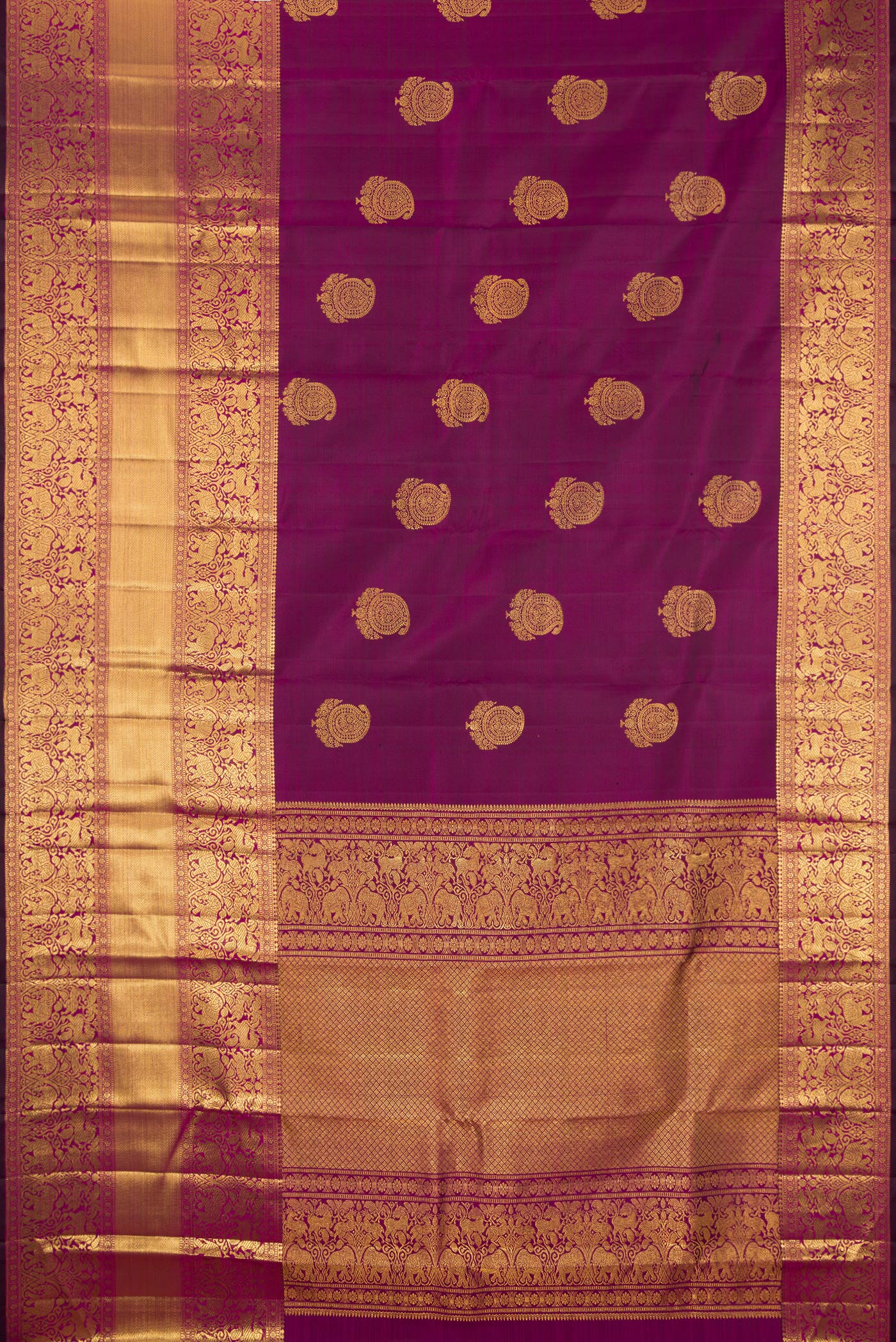 Flat view of Magenta Dual Tone Kanchipuram Silk Saree with Zari Butta on the body and Fancy Border. 