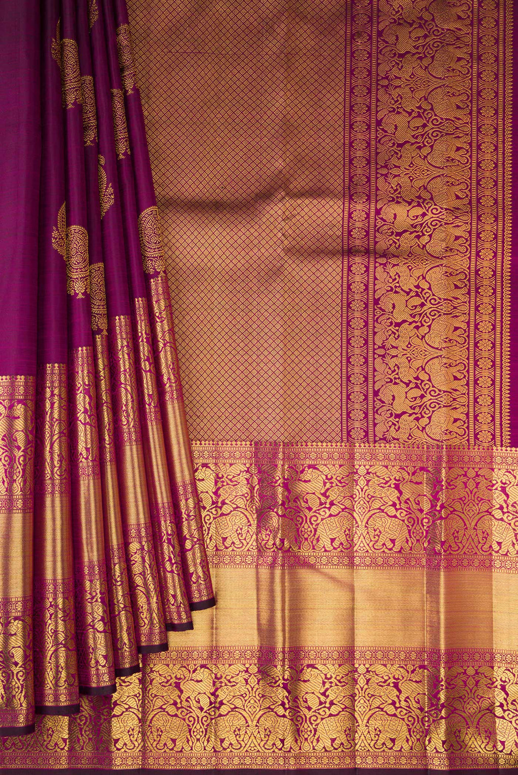 Pleats and pallu of Magenta Dual Tone Kanchipuram Silk Saree with Zari Butta on the body and Fancy Border. 