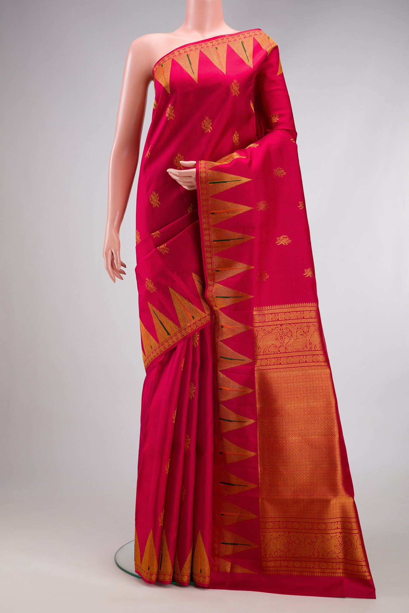 Maroon Kanchipuram Silk Saree with Zari Butta on the body and Paithani Border.  displayed on a mannequin