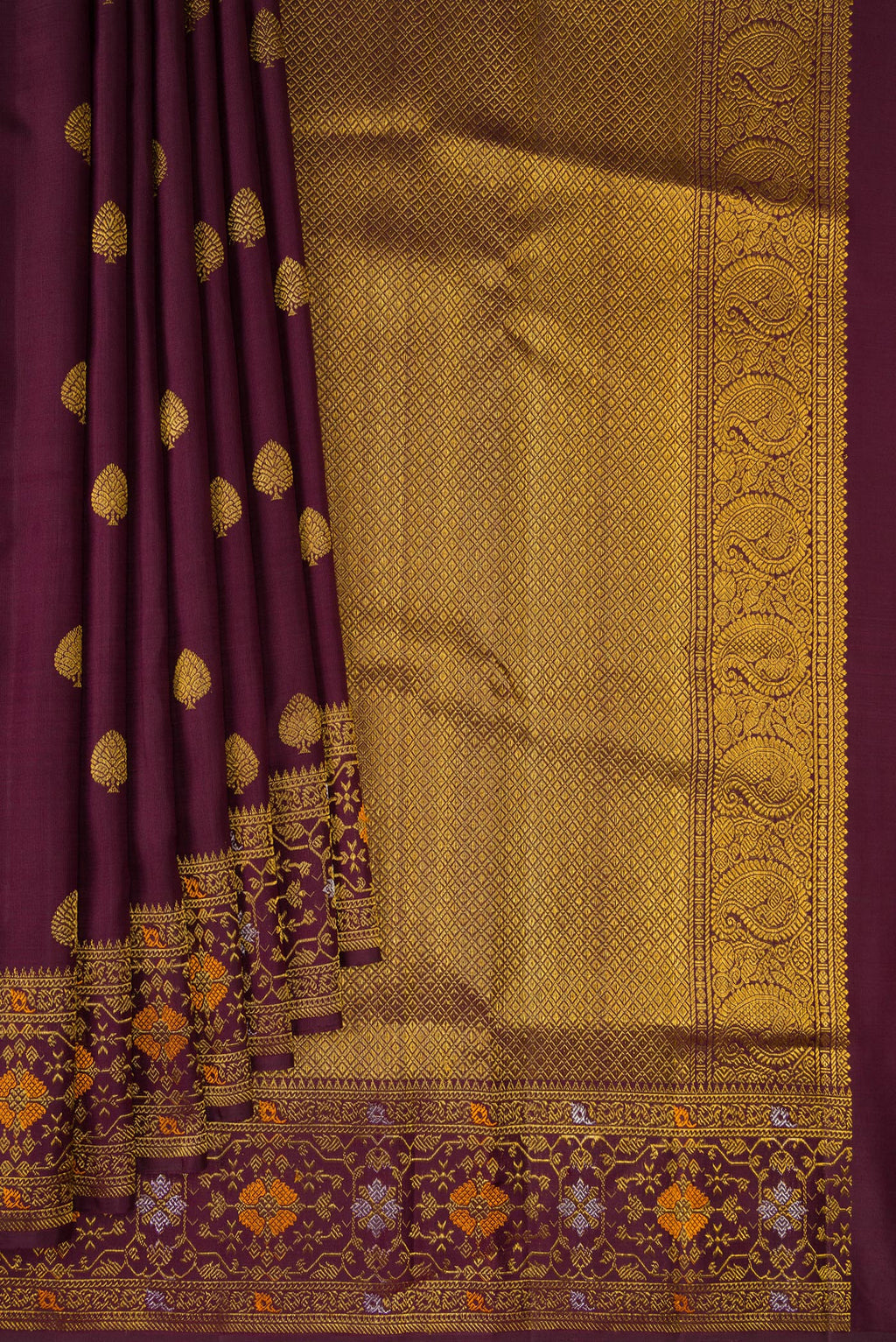 Pleats and pallu of Coffee Brown Kanchipuram Silk Saree with Zari Butta on the body and Fancy Border. 