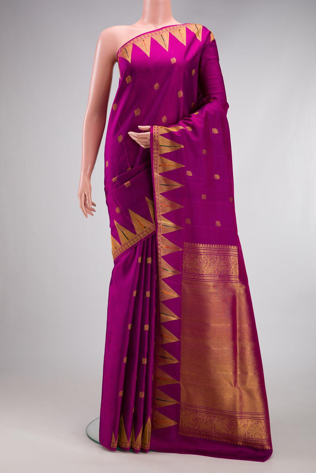 Magenta Kanchipuram Silk Saree with Zari Butta on the body and Paithani Border.  displayed on a mannequin