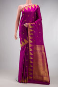 Magenta Kanchipuram Silk Saree with Zari Butta on the body and Paithani Border.  displayed on a mannequin