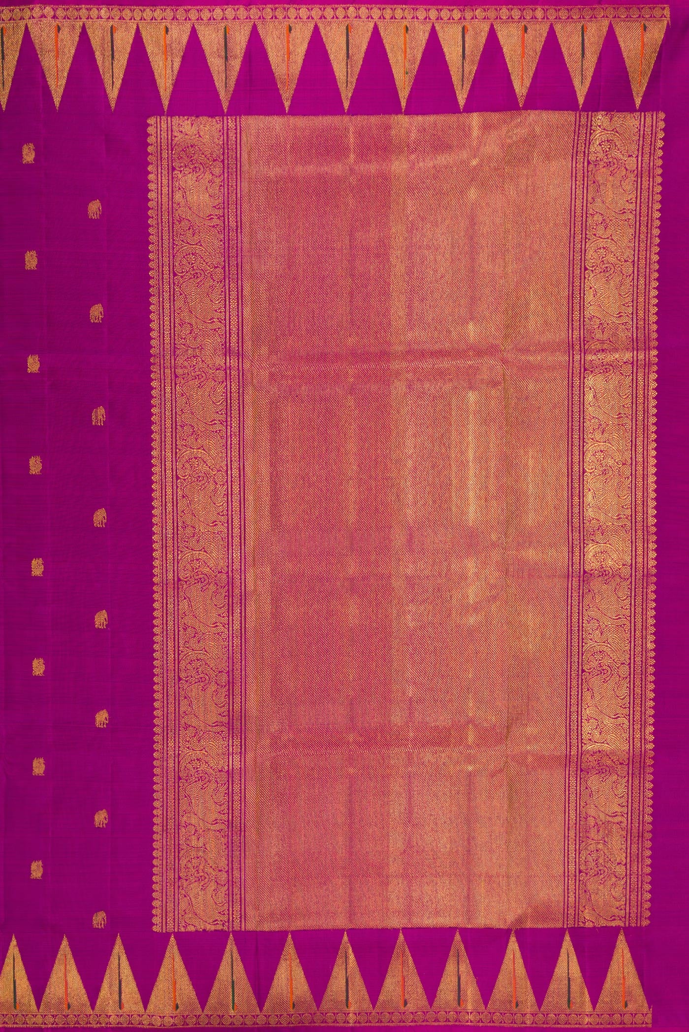Close up image of the pallu of Magenta Kanchipuram Silk Saree with Zari Butta on the body and Paithani Border. 