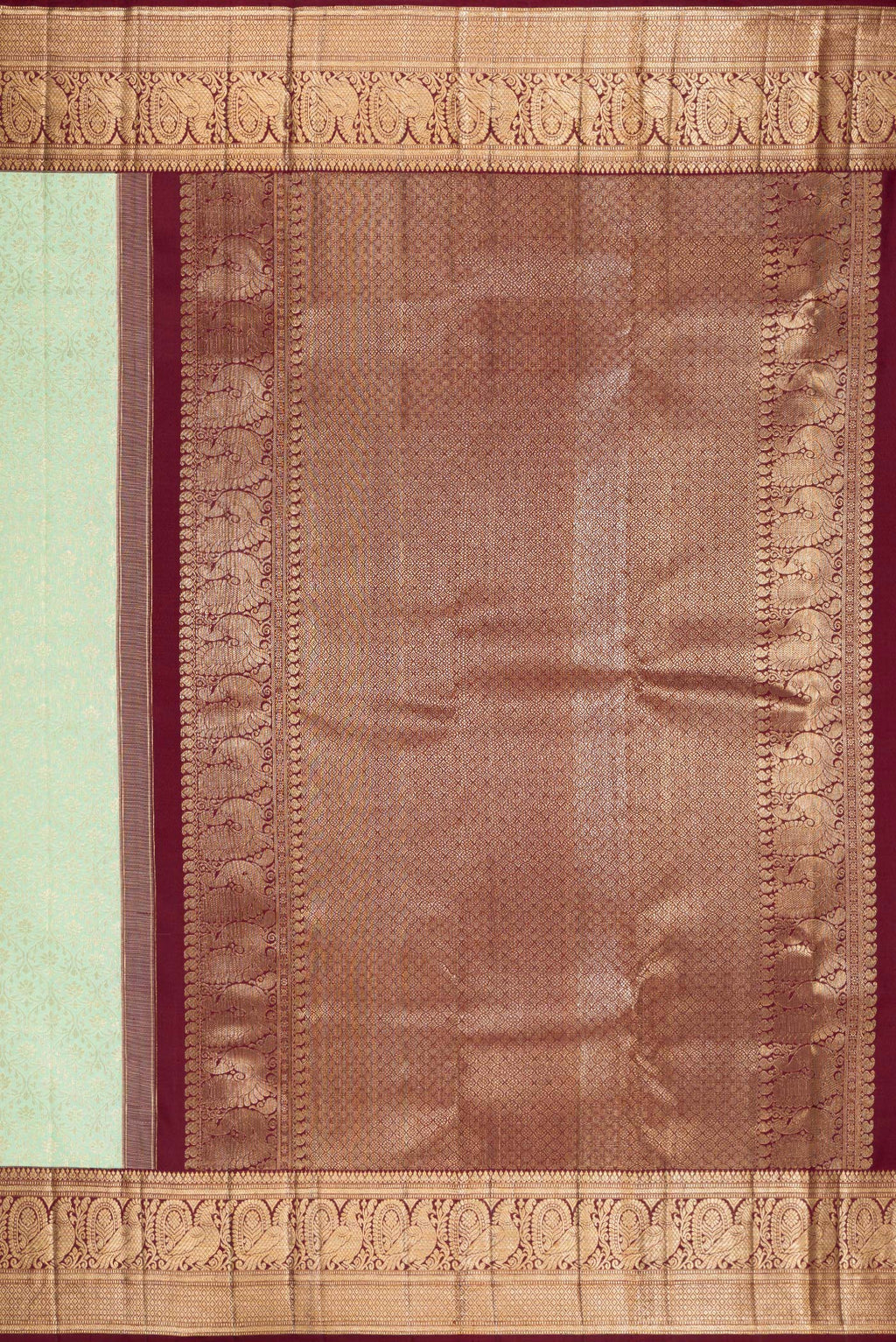 Close up image of the pallu of Pista Green Kanchipuram Silk Saree with Zari Brocade on the body and Zari Border. 