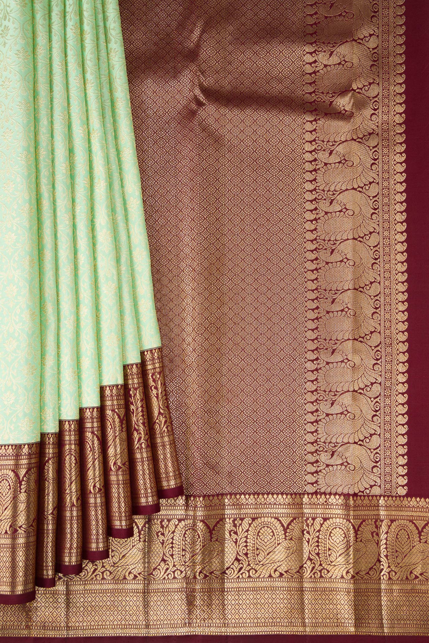 Pleats and pallu of Pista Green Kanchipuram Silk Saree with Zari Brocade on the body and Zari Border. 
