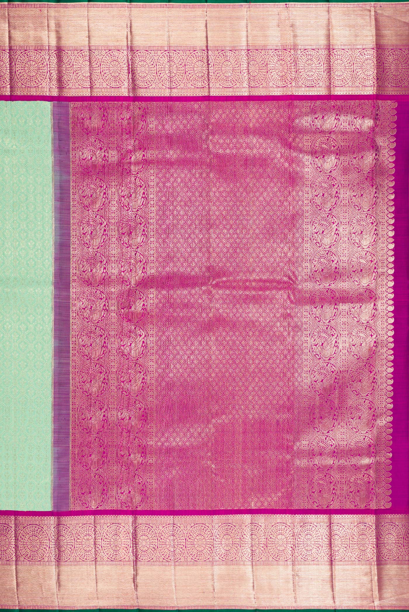 Close up image of the pallu of Pista Green Kanchipuram Silk Saree with Zari Brocade on the body and Zari Border. 