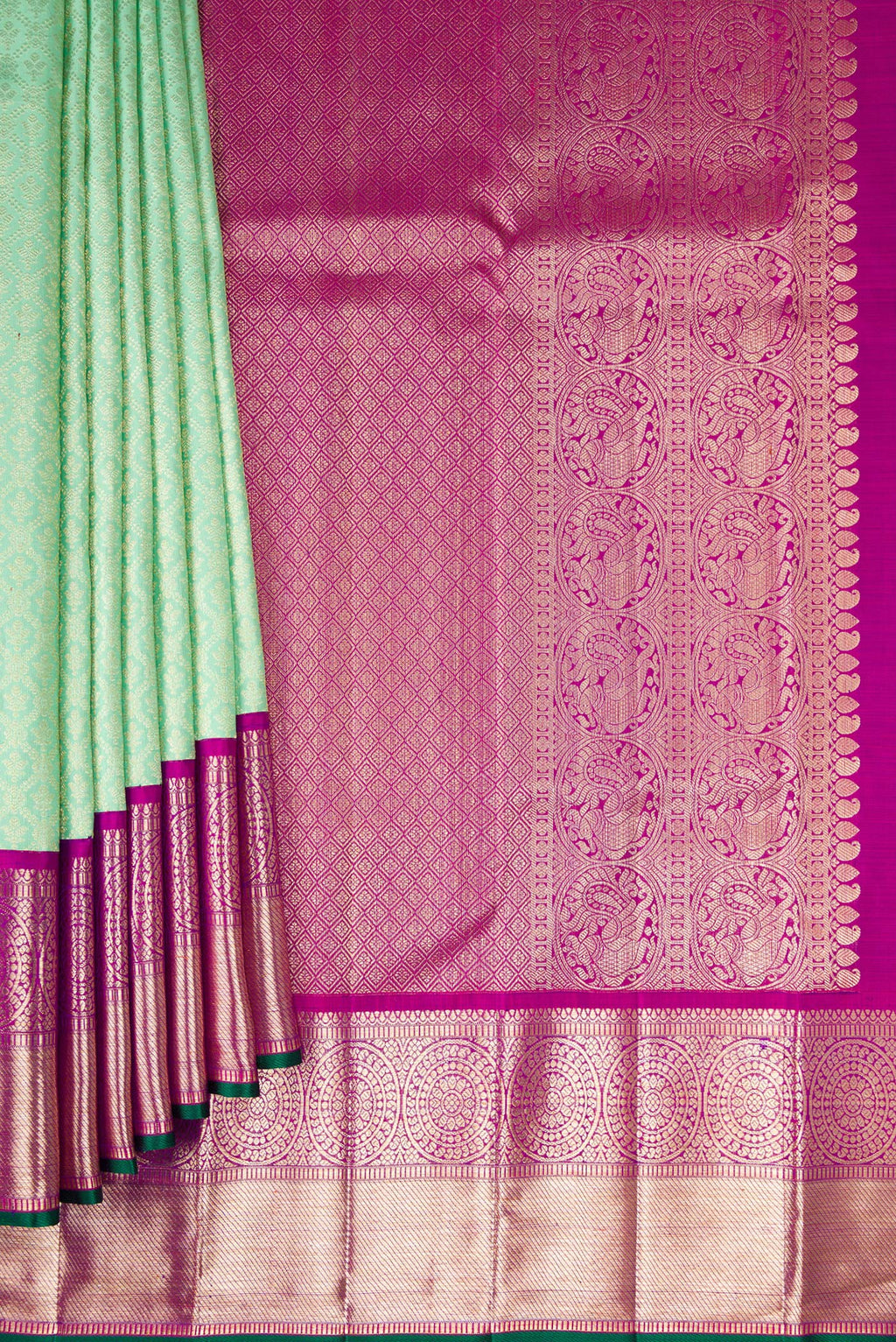 Pleats and pallu of Pista Green Kanchipuram Silk Saree with Zari Brocade on the body and Zari Border. 