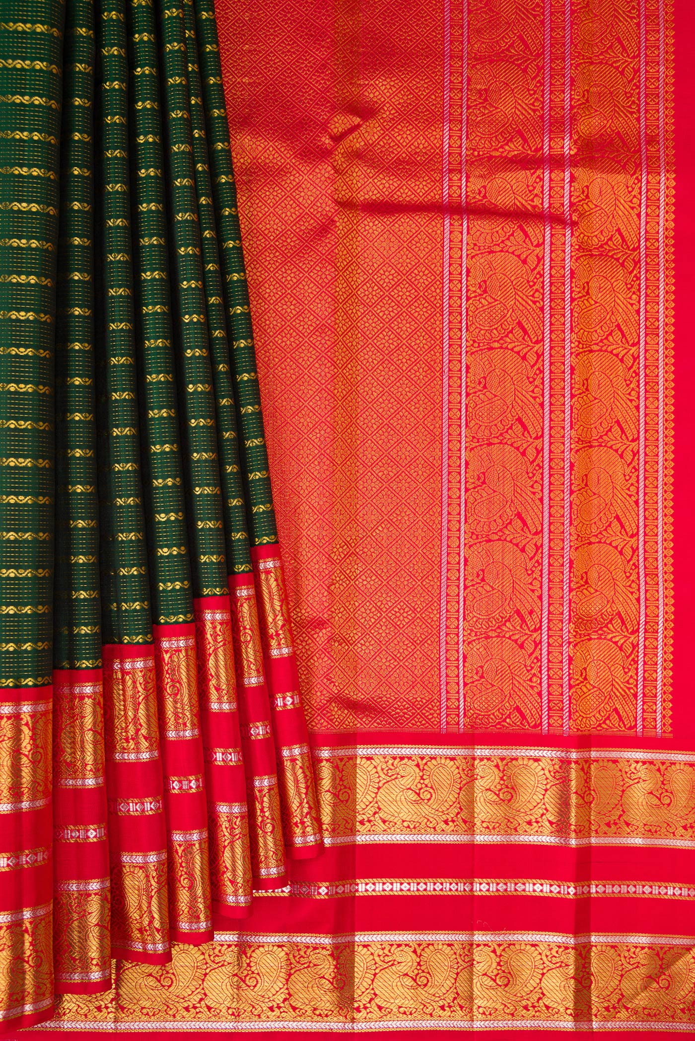 Pleats and pallu of Bottle Green Kanchipuram Silk Saree with Veldhari on the body and Zari Border. 
