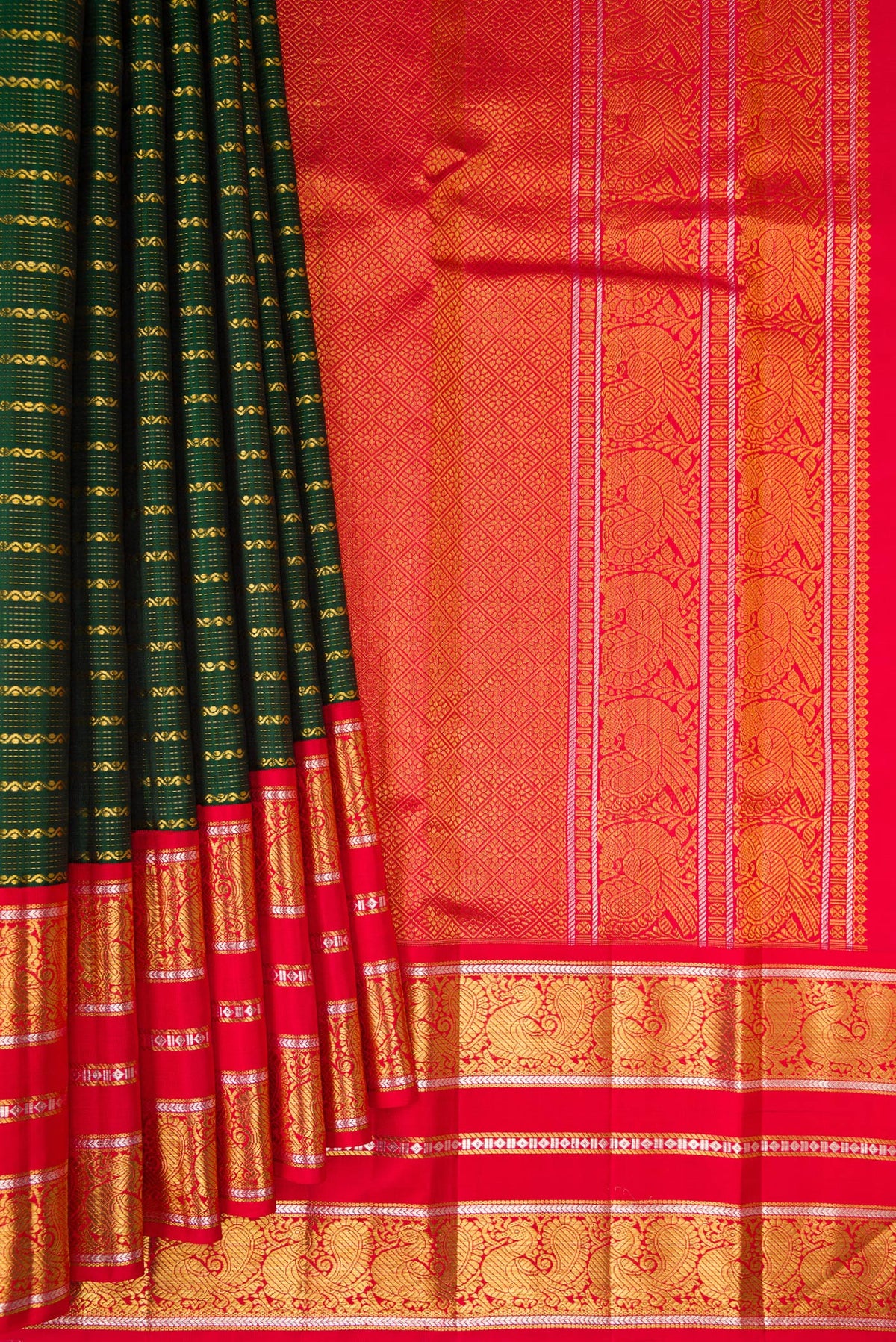 Pleats and pallu of Bottle Green Kanchipuram Silk Saree with Veldhari on the body and Zari Border. 