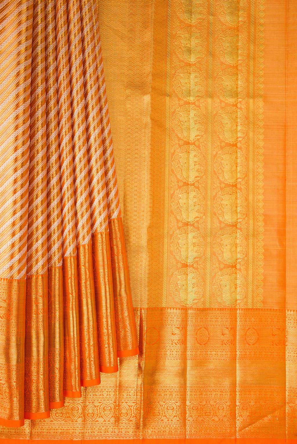 Pleats and pallu of Orange Dual Tone Kanjivaram Tissue Saree with Zari Brocade on the body and Fancy Border. 