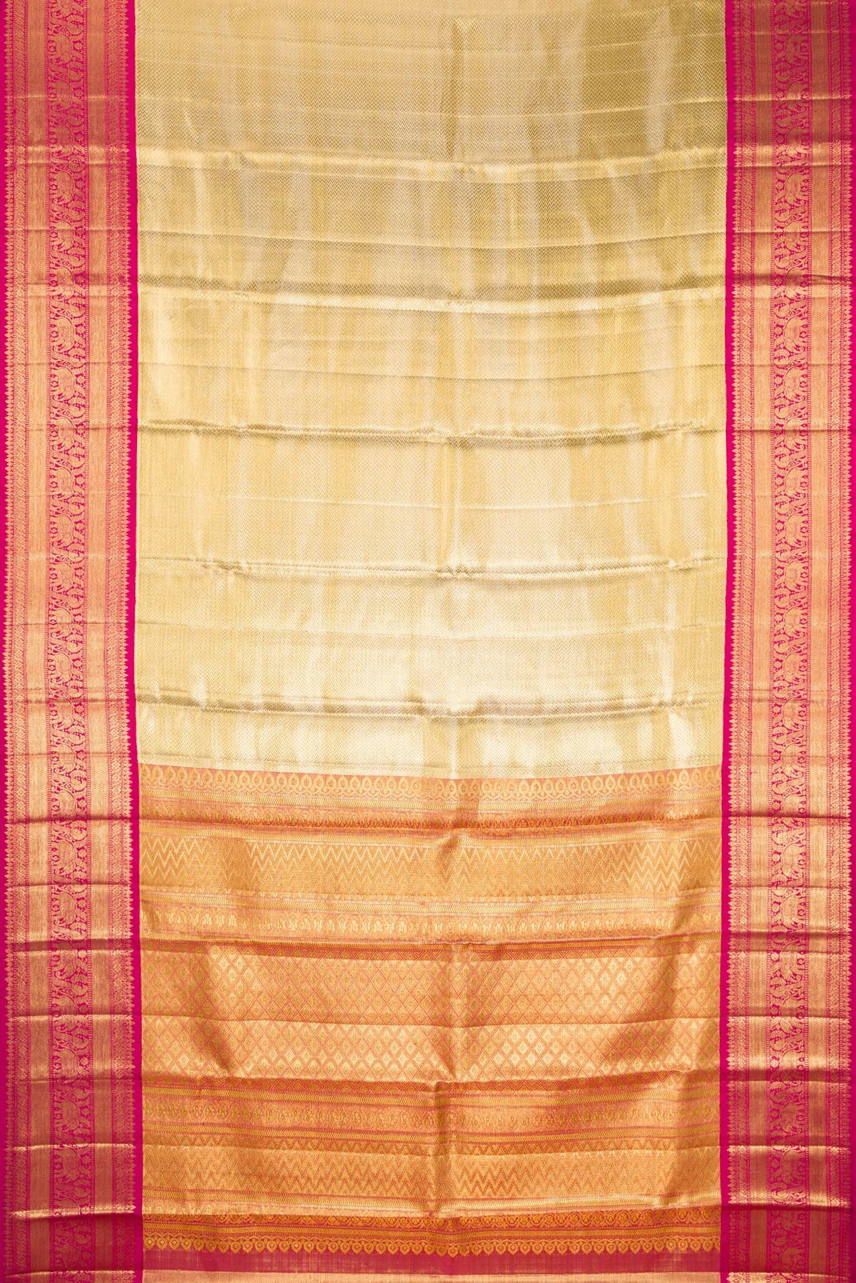 Flat view of Gold Dual Tone Kanjivaram Tissue Saree with Zari Brocade on the body and Fancy Border. 