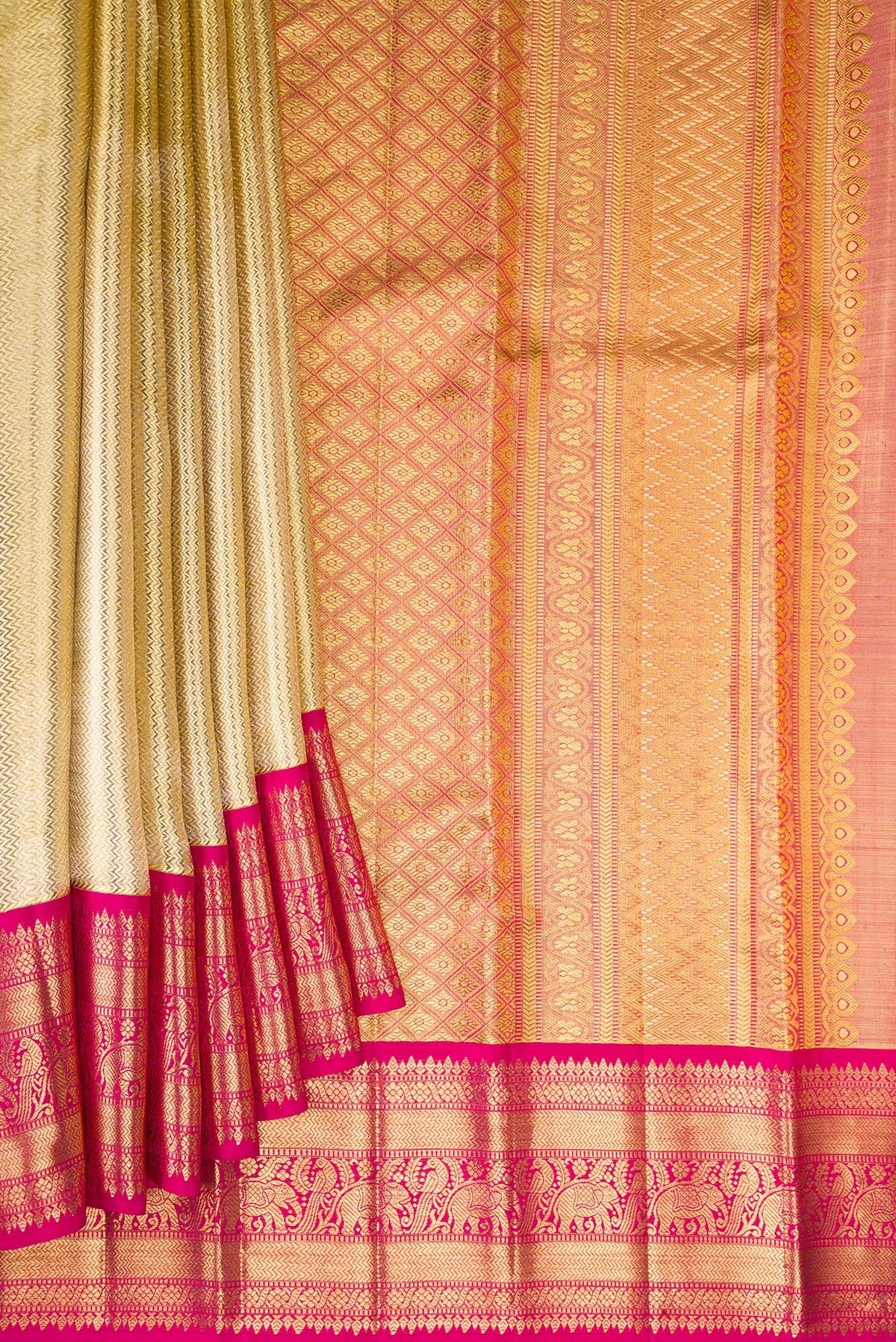 Pleats and pallu of Gold Dual Tone Kanjivaram Tissue Saree with Zari Brocade on the body and Fancy Border. 