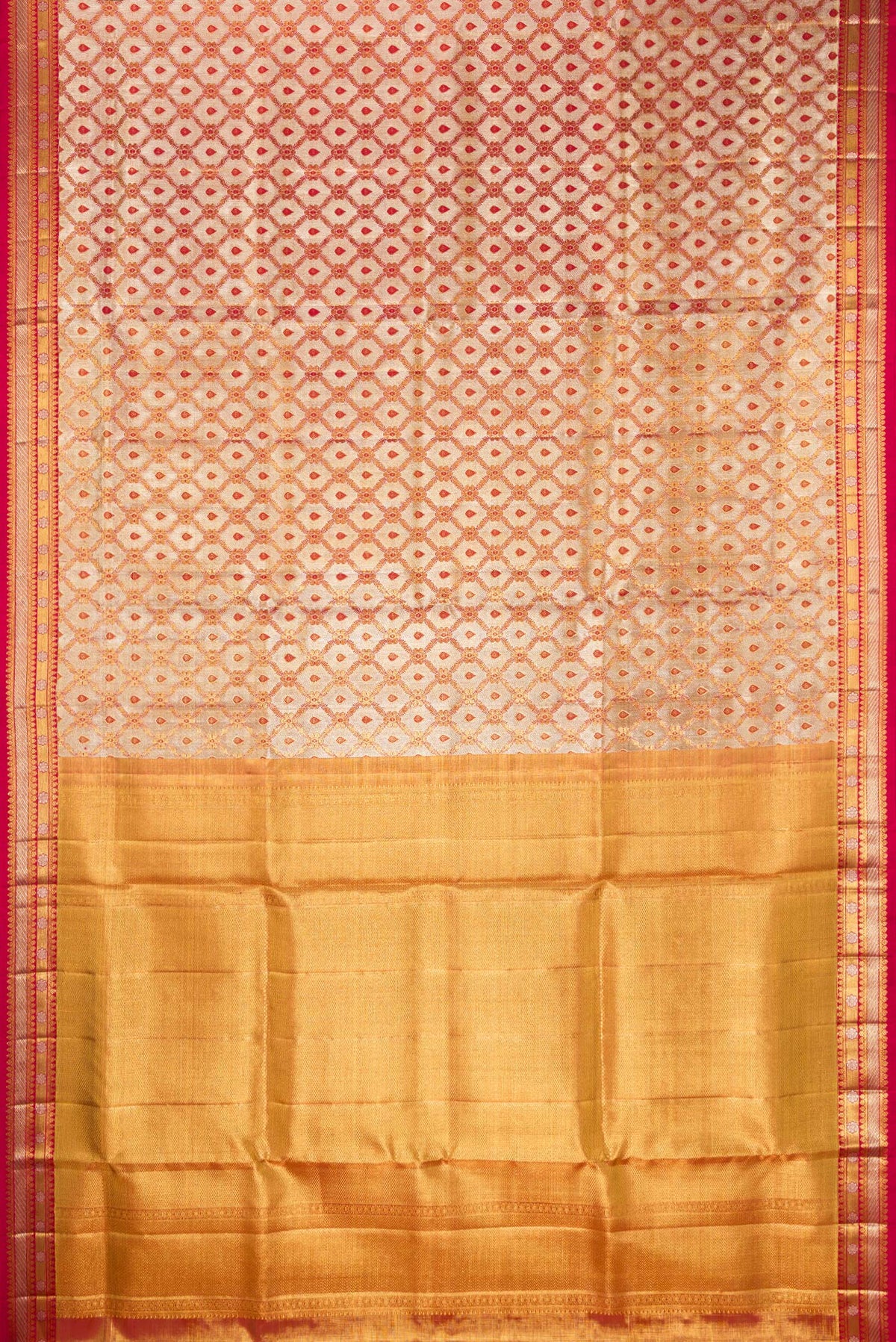 Flat view of Gold Dual Tone Kanjivaram Tissue Saree with Zari Brocade on the body and Fancy Border. 