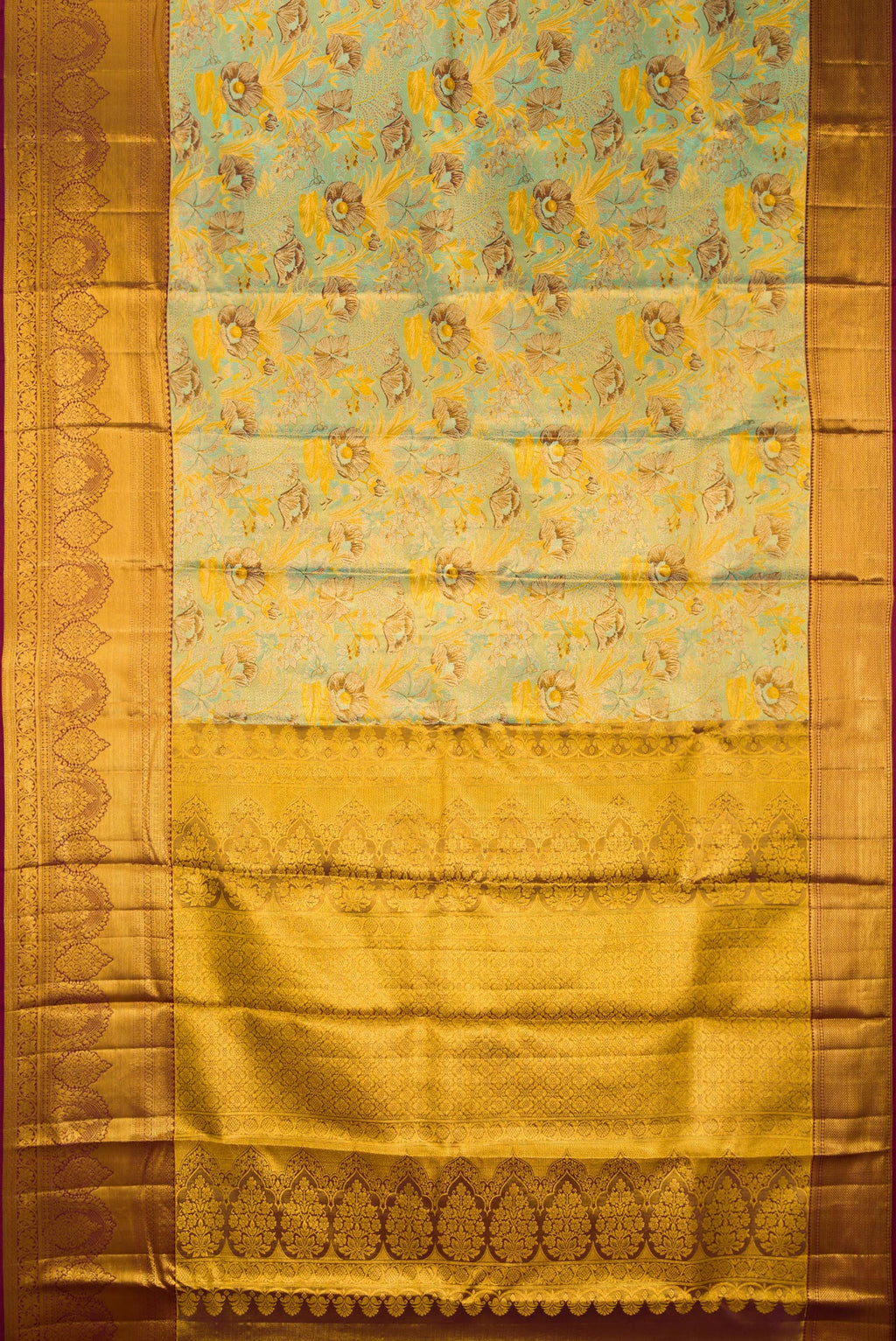 Flat view of Sea Green Dual Tone Kanjivaram Tissue Saree with Zari Brocade on the body and Fancy Border. 