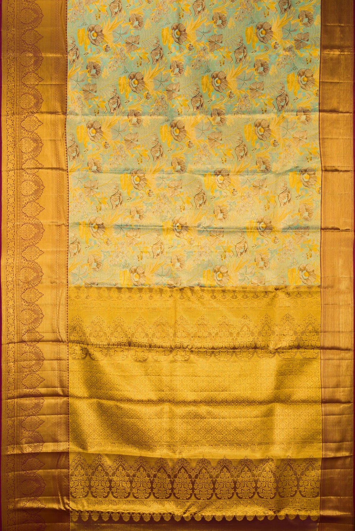 Flat view of Sea Green Dual Tone Kanjivaram Tissue Saree with Zari Brocade on the body and Fancy Border. 