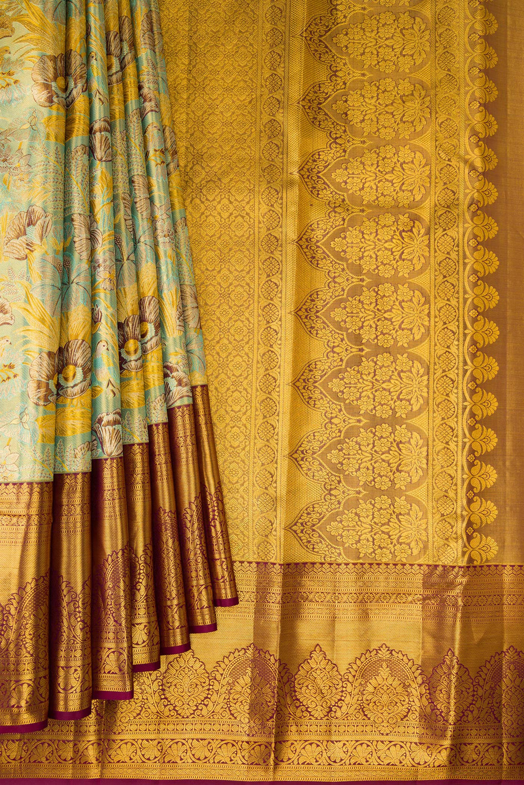 Pleats and pallu of Sea Green Dual Tone Kanjivaram Tissue Saree with Zari Brocade on the body and Fancy Border. 