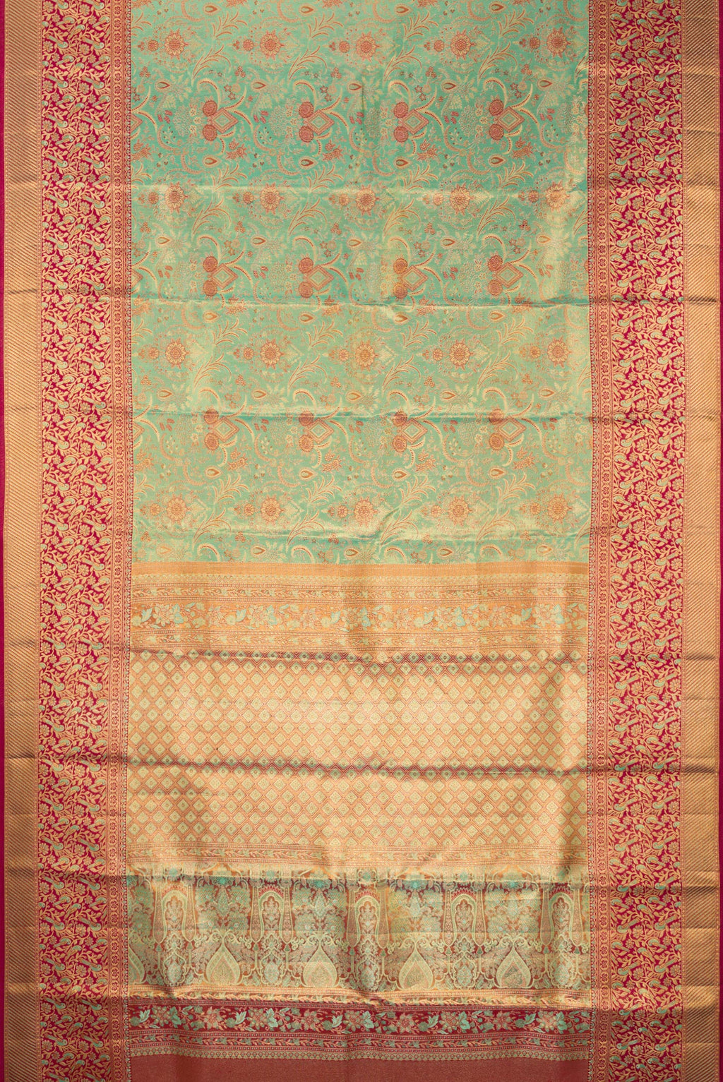 Flat view of Sea Green Dual Tone Kanjivaram Tissue Saree with Zari Brocade on the body and Fancy Border. 