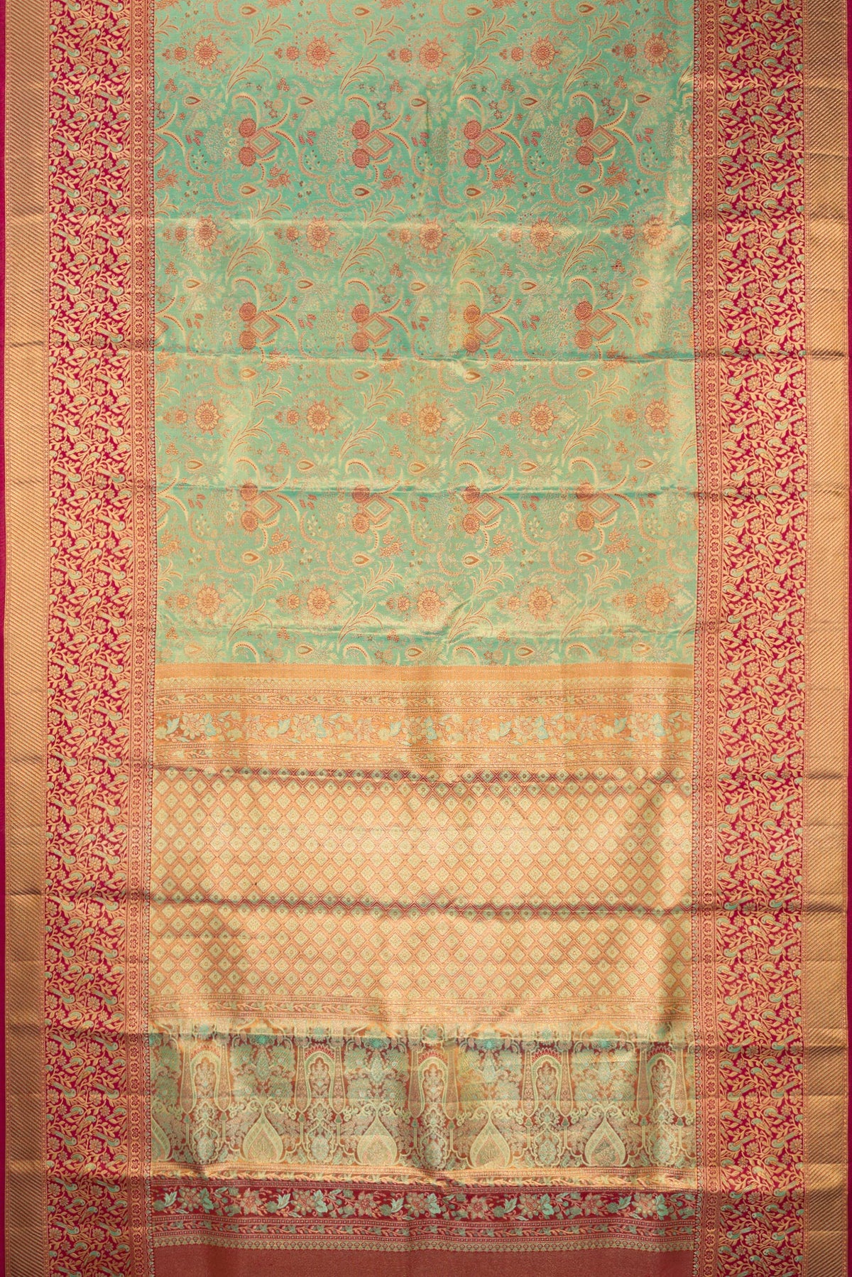 Flat view of Sea Green Dual Tone Kanjivaram Tissue Saree with Zari Brocade on the body and Fancy Border. 