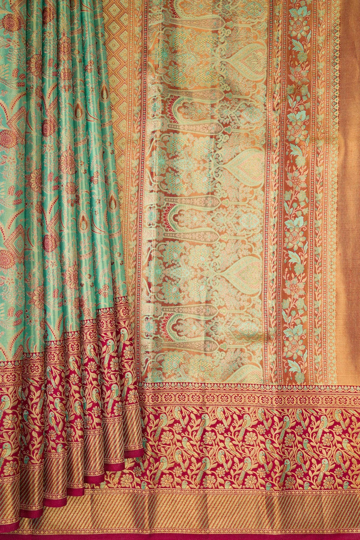 Pleats and pallu of Sea Green Dual Tone Kanjivaram Tissue Saree with Zari Brocade on the body and Fancy Border. 