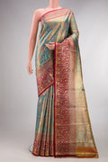 Turquoise Dual Tone Kanjivaram Tissue Saree with Zari Brocade on the body and Fancy Border.  displayed on a mannequin