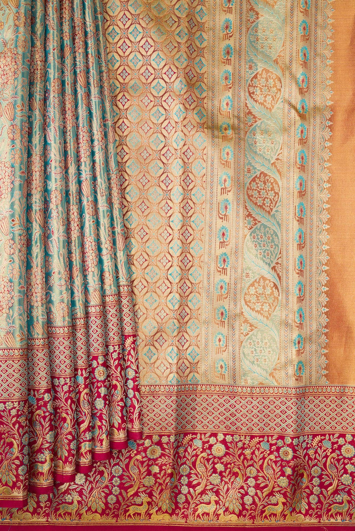 Pleats and pallu of Turquoise Dual Tone Kanjivaram Tissue Saree with Zari Brocade on the body and Fancy Border. 
