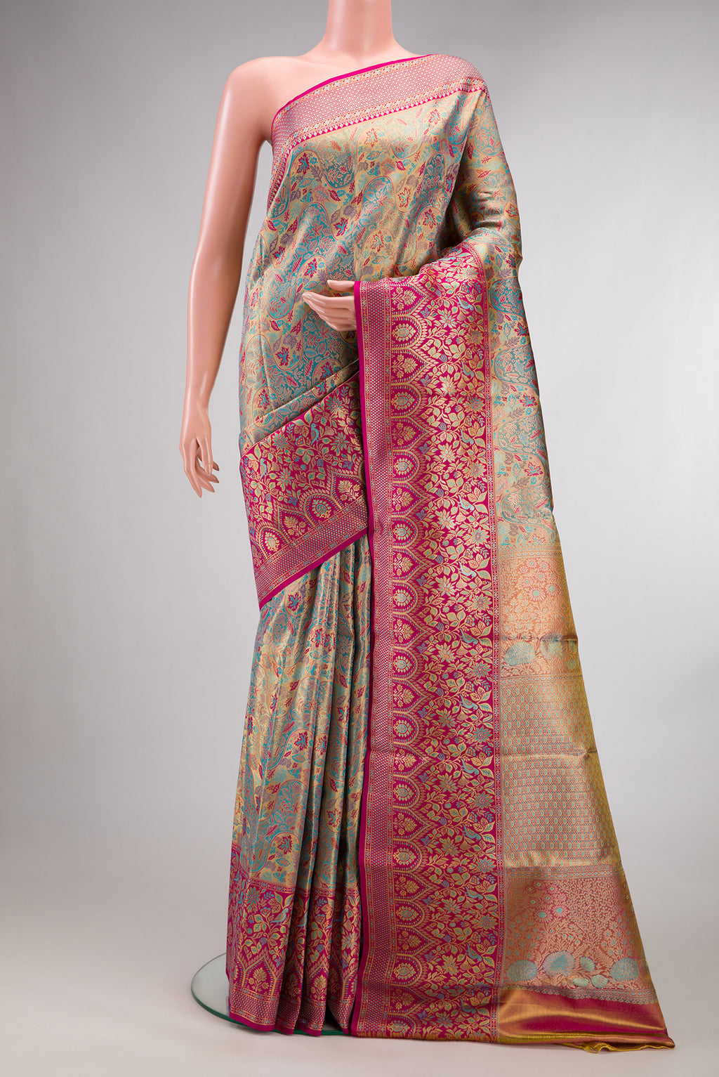 Turquoise Dual Tone Kanjivaram Tissue Saree with Zari Brocade on the body and Fancy Border.  displayed on a mannequin