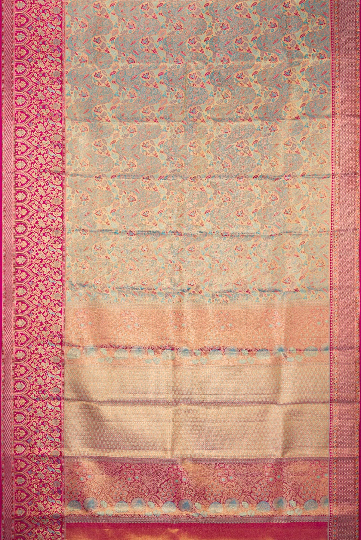 Flat view of Turquoise Dual Tone Kanjivaram Tissue Saree with Zari Brocade on the body and Fancy Border. 