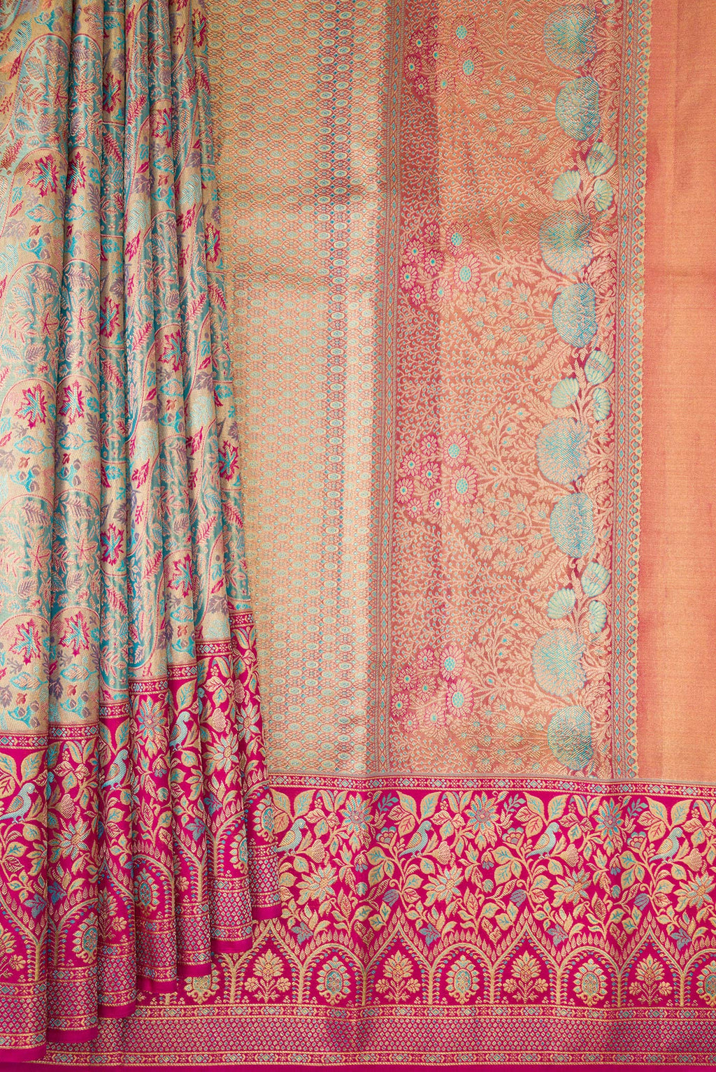 Pleats and pallu of Turquoise Dual Tone Kanjivaram Tissue Saree with Zari Brocade on the body and Fancy Border. 
