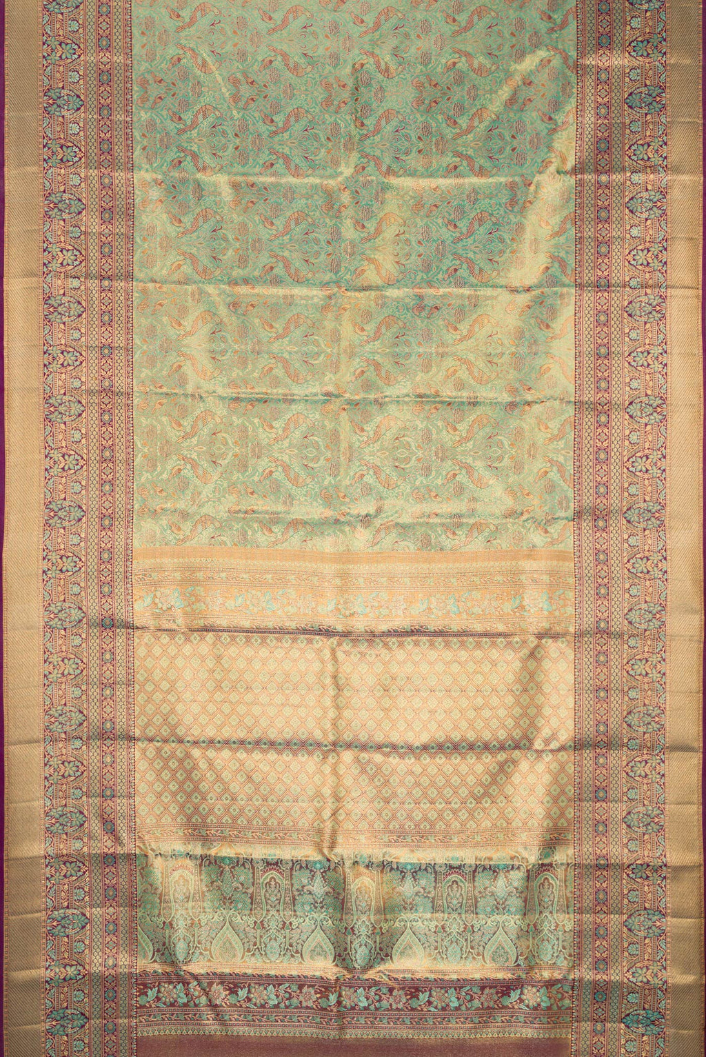 Flat view of Sea Green Dual Tone Kanjivaram Tissue Silk Saree with Zari Brocade on the body and Fancy Border. 