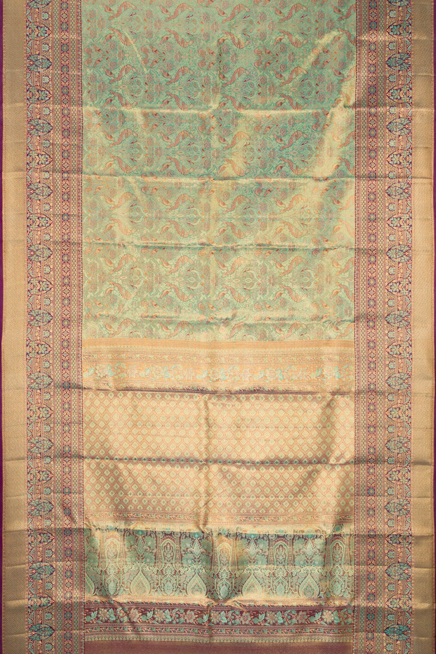 Flat view of Sea Green Dual Tone Kanjivaram Tissue Silk Saree with Zari Brocade on the body and Fancy Border. 