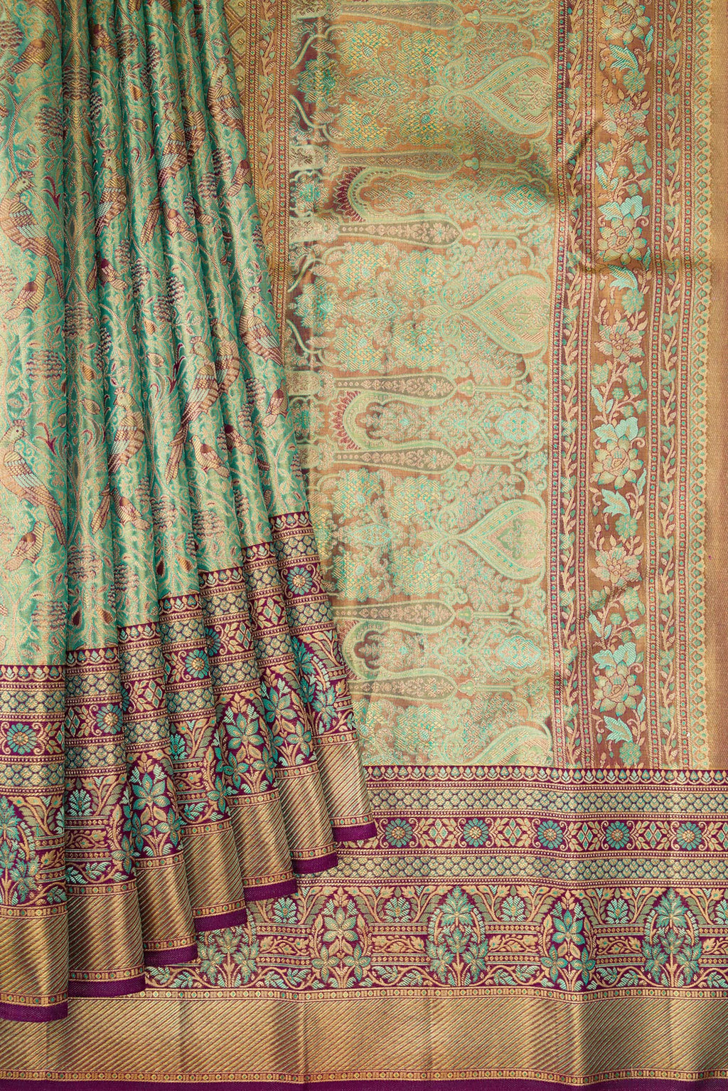 Pleats and pallu of Sea Green Dual Tone Kanjivaram Tissue Silk Saree with Zari Brocade on the body and Fancy Border. 