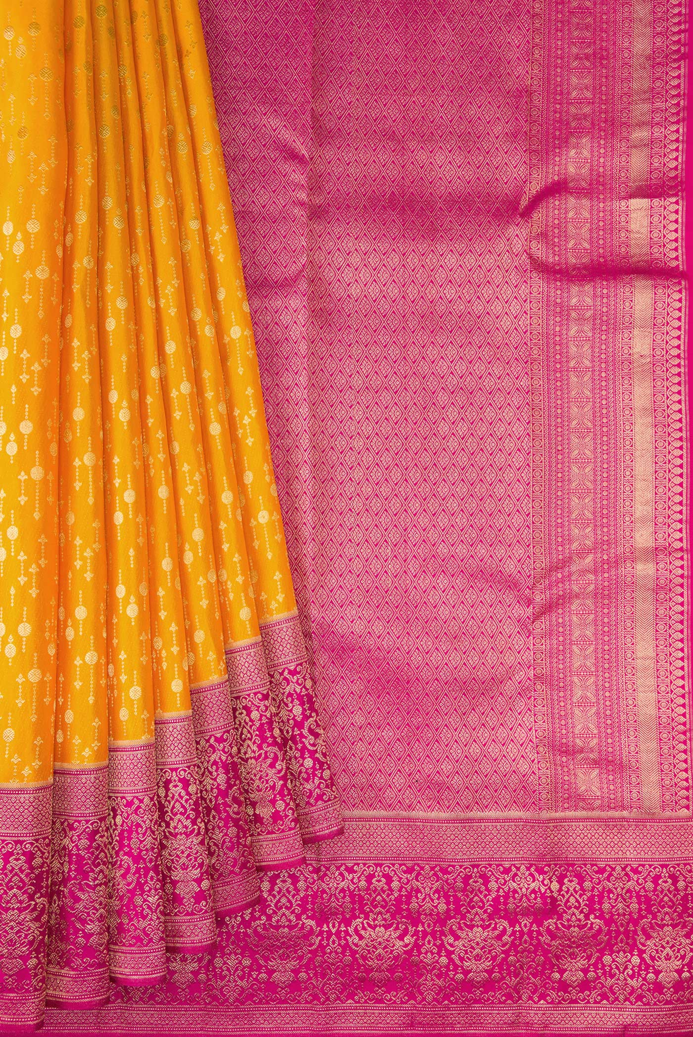 Pleats and pallu of Mustard Kanchipuram Silk Saree with Zari Brocade on the body and Fancy Border. 