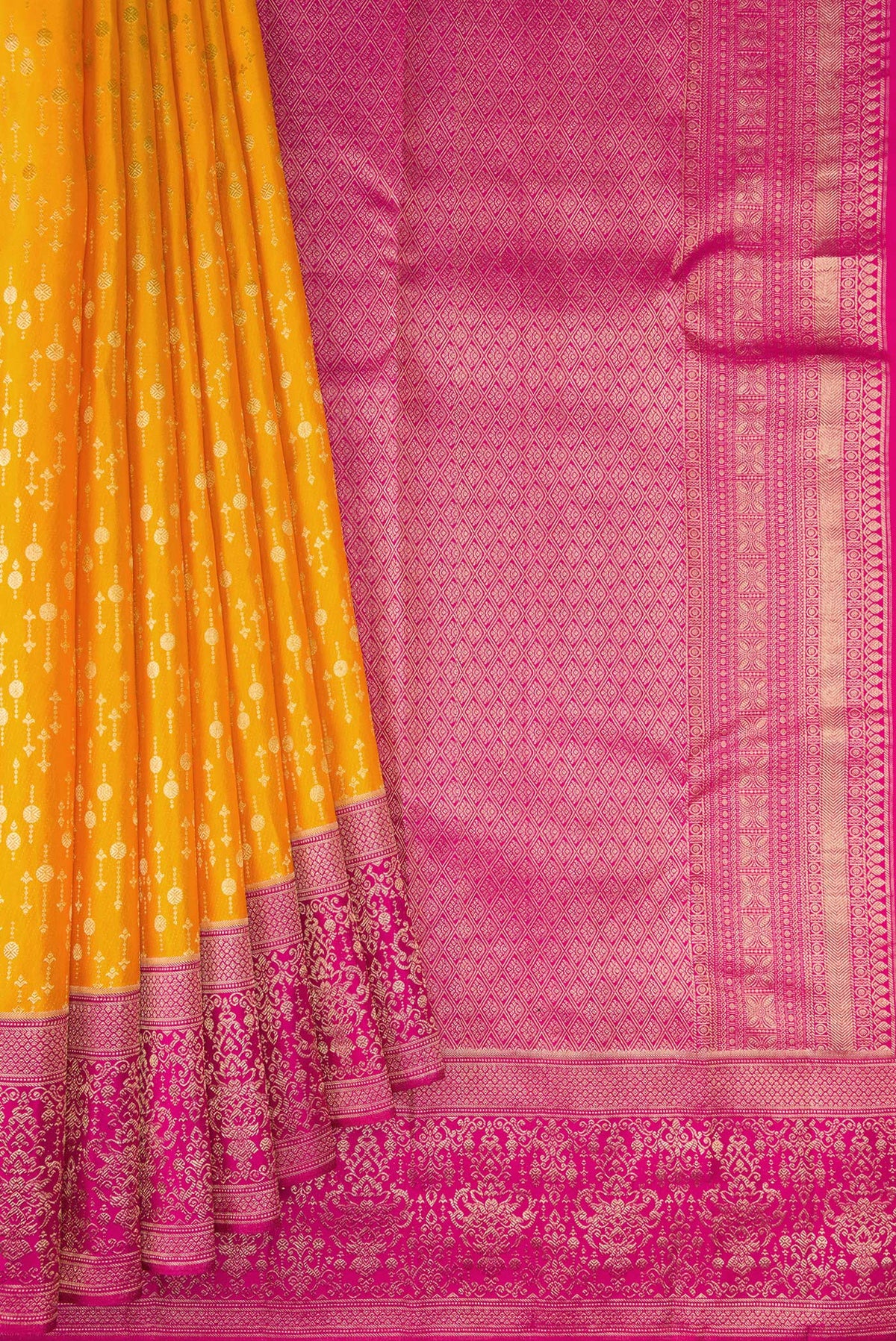 Pleats and pallu of Mustard Kanchipuram Silk Saree with Zari Brocade on the body and Fancy Border. 