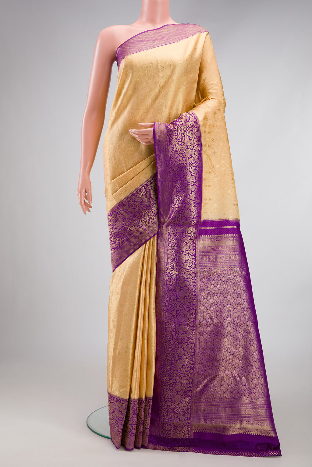 Sandal Kanchipuram Silk Saree with Zari Brocade on the body and Fancy Border.  displayed on a mannequin
