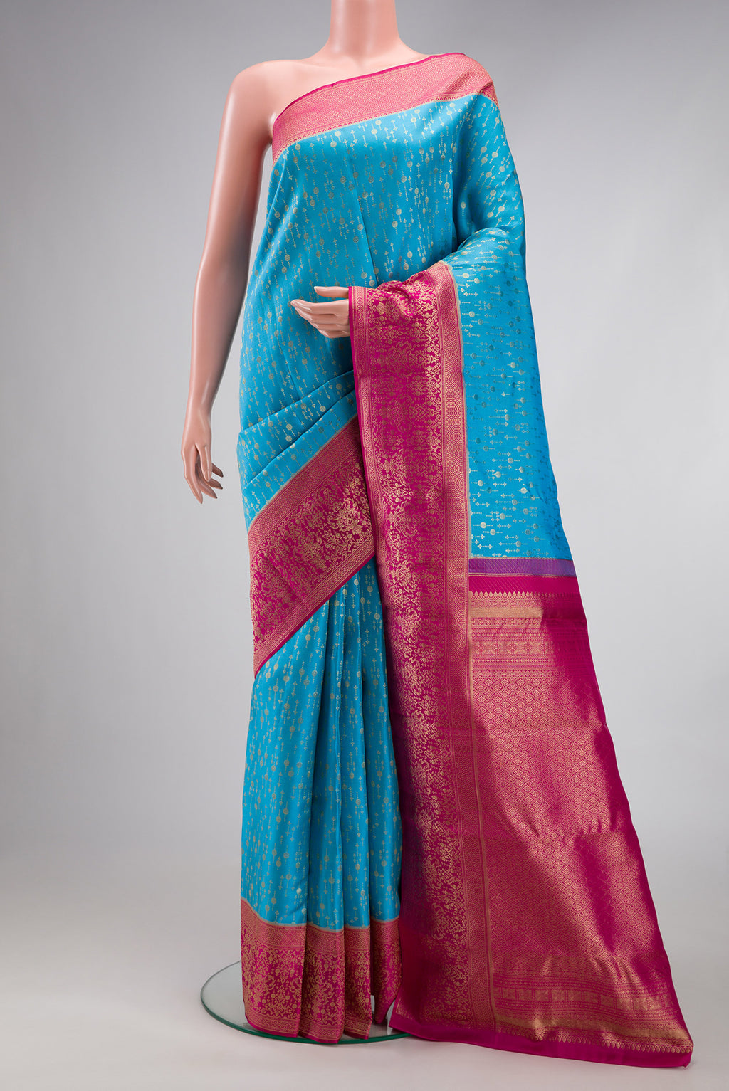 Sky Blue Kanchipuram Silk Saree with Zari Brocade on the body and Zari Border.  displayed on a mannequin